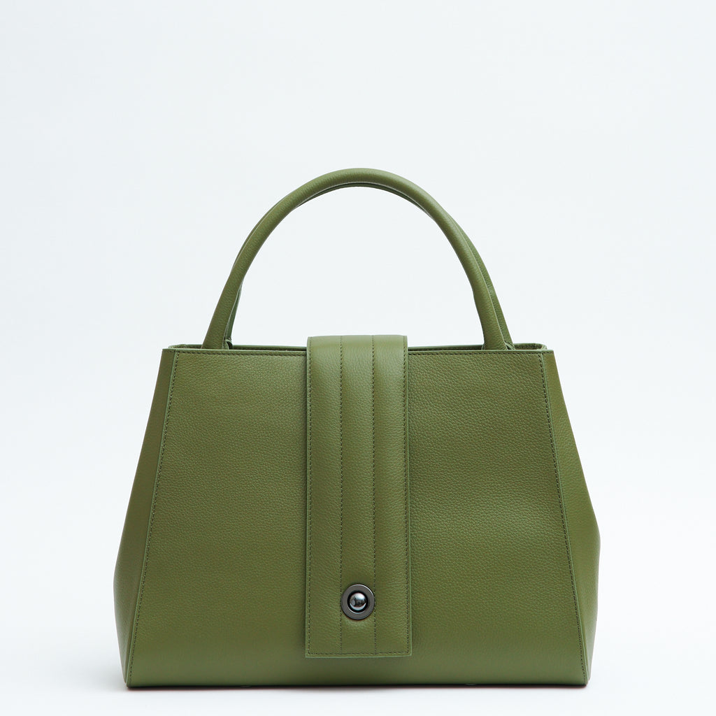 The product photo of an olive green leather handbag. The handbag has a classic trapeze shape with a straight quilted flap in the middle and top handles. This is the front view of the Tomoli Briffani Lean interchangeable tote handbag in Olive Green. This bag can be used as an everyday bag, a work tote, or even an oversized clutch.