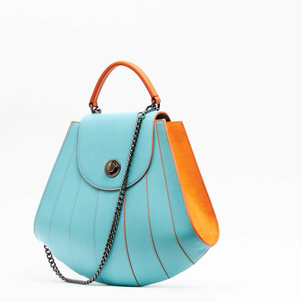 Premium designer blue leather handbag with a top handle, a unique and colorful Mother's Day gift.