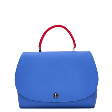 The product photo of a colorful blue purple and red top handle leather handbag. The handbag has a blue purple oversized round flap cover on a blue purple body. The handle is red. This is the Tomoli Briffani Jut in Hot Iris.