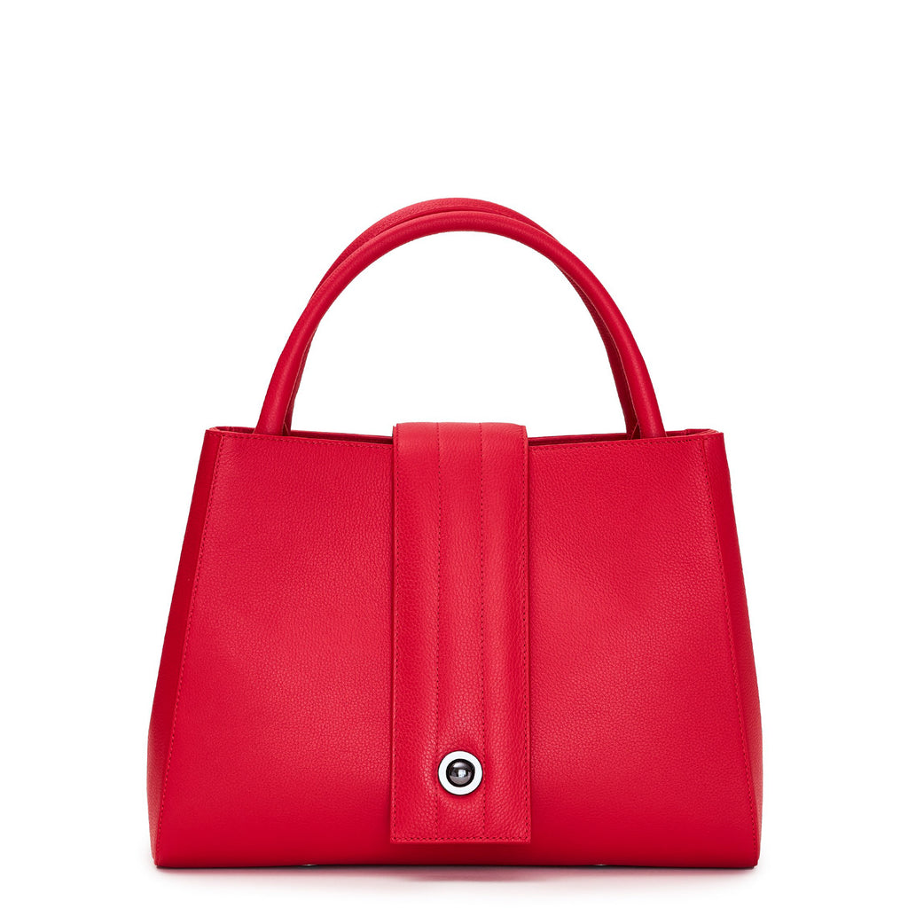 The product photo of a red leather handbag. The handbag has a classic trapeze shape with a straight quilted flap in the middle and top handles. This is the front view of the Tomoli Briffani Lean interchangeable tote handbag in Red. This bag can be used as an everyday bag, a work tote, or even an oversized clutch.